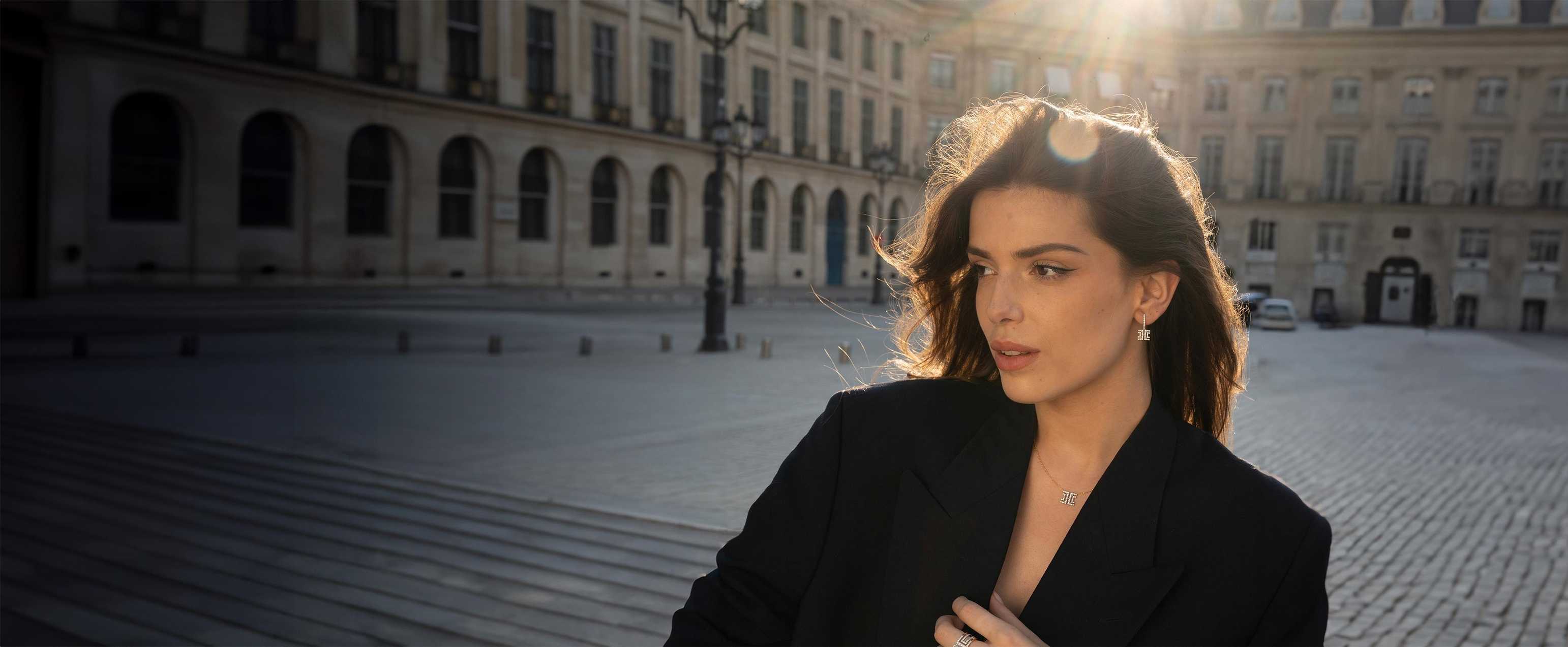 Model in Paris wearing pieces from the Entre-Deux collection, illuminated by golden sunlight.