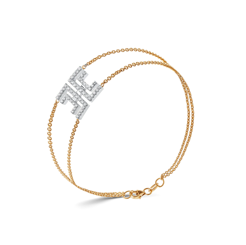 Harper bracelet in yellow gold with a dual chain and geometric diamond-studded motif.